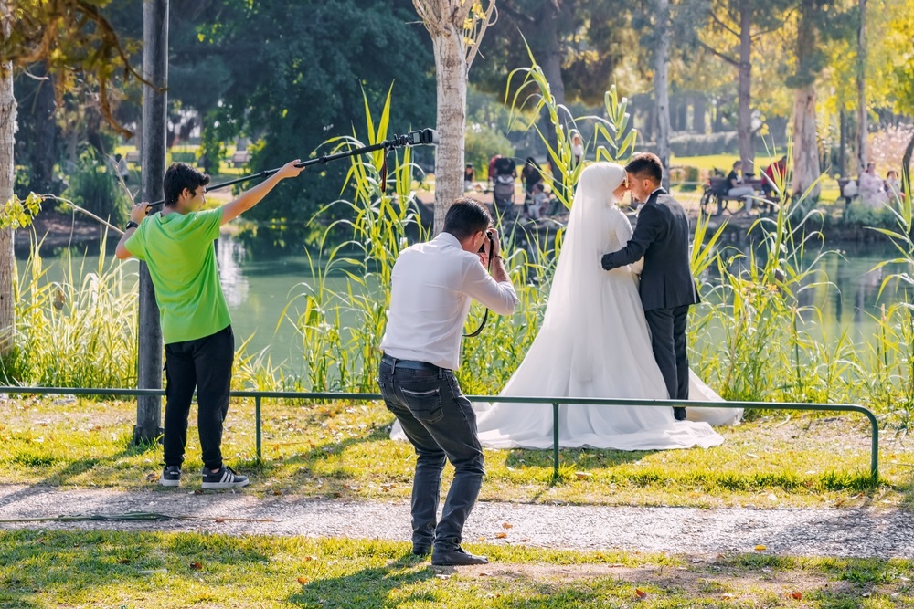 Wedding photographer gear setup and client consultation.