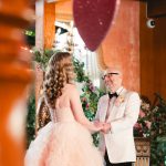 the groom gazes lovingly at the bride