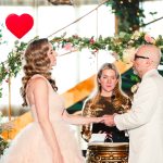 the groom puts the wedding ring on the bride's finger