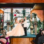 the couple laughs and celebrates as they are pronounced married