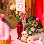 pink, red, blue florals, glass vases and vintage elements decorate the tables