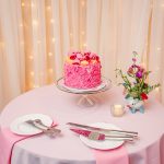 the pink champagne cake is a pink frosting covered vanilla filled masterpiece only found at Madonna Inn
